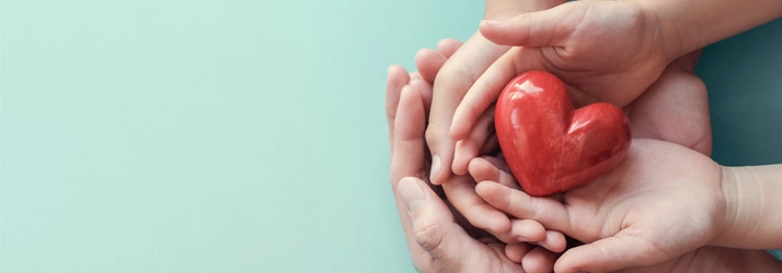 Chiropractic Louisville KY Hands Holding Heart