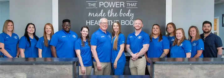 Chiropractor Louisville KY Patrick Lowe & Dr. Cannon & Dr. Curio & Dr. Bentley & Dr. Courtney Paulson With Team